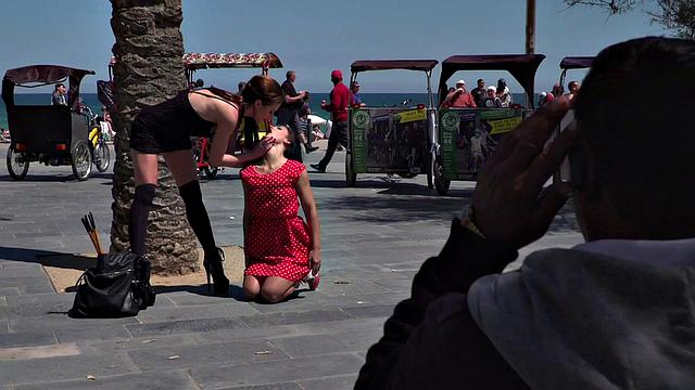 Kinky tattooed brunette sub gagged and humiliated by her domme in public