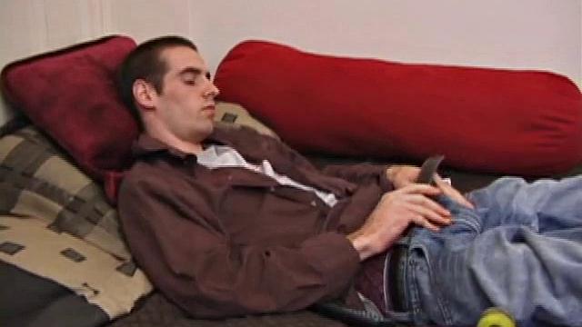 Just back from skateboarding, James wants to squeeze one out so he turns on a porn video and begins working his huge cock, with a Prince Albert piercing. Some lube helps the process and soon his dick is stiff and ready.