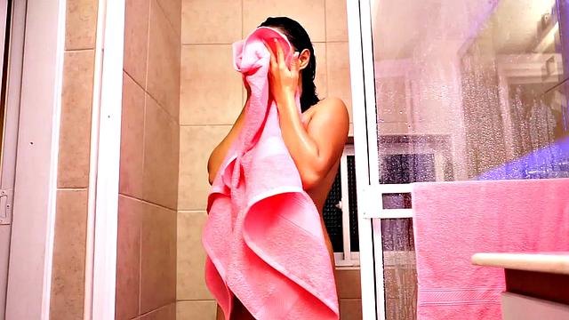 Lia Ponce showers, shows her natural tits and pussy up close. She rubs her pussy and fingers hard