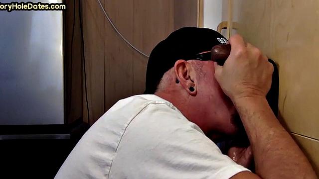 Gloryhole DILF sucks black penis with greedy mouth