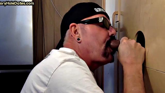 Gloryhole DILF sucks black penis with greedy mouth