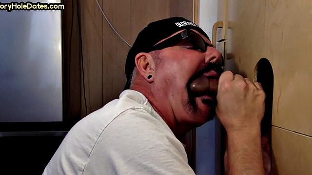 Gloryhole DILF sucks black penis with greedy mouth