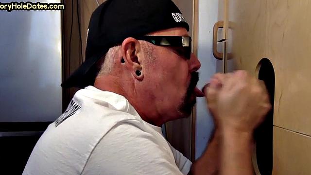 Gloryhole DILF sucks black penis with greedy mouth