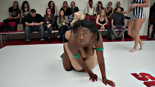 Group of amateur wrestlers perform their fight in public