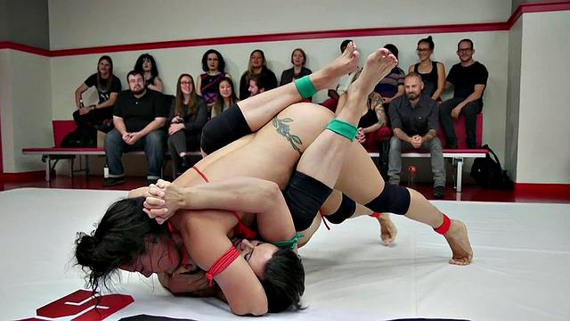 Group of amateur wrestlers perform their fight in public