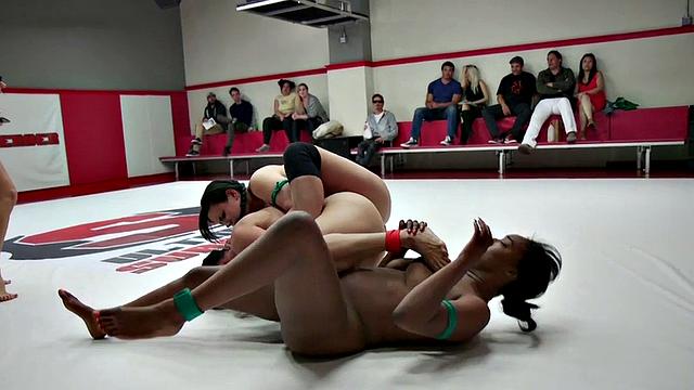 Group of amateur wrestlers perform their fight in public