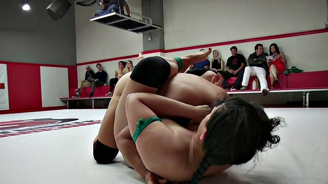 Group of amateur wrestlers perform their fight in public