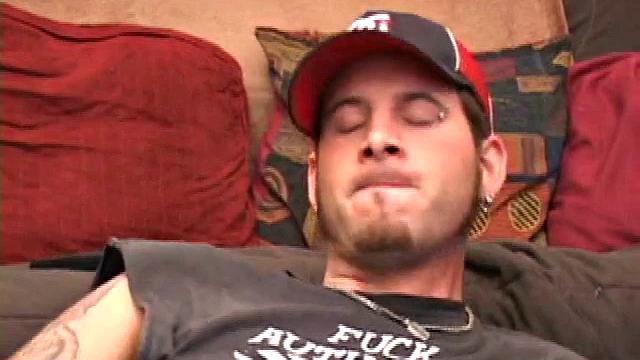 Pierced punk Elijah Mageddon goes to work on his cock. After stroking his stiff dick to the porn video, he pumps out his warm cum load onto the skateboard.