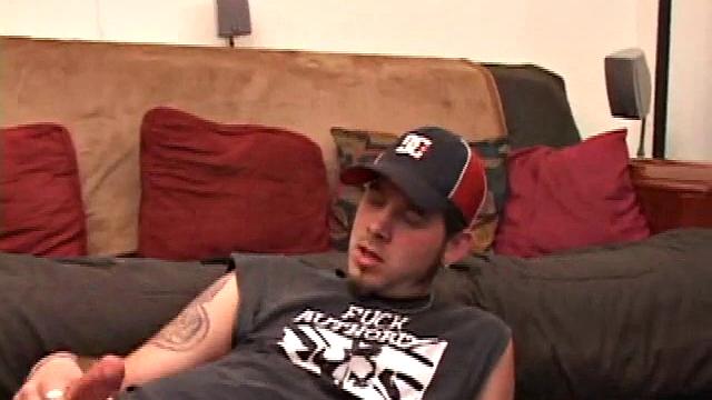 Pierced punk Elijah Mageddon goes to work on his cock. After stroking his stiff dick to the porn video, he pumps out his warm cum load onto the skateboard.