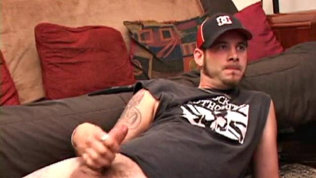 Pierced punk Elijah Mageddon goes to work on his cock. After stroking his stiff dick to the porn video, he pumps out his warm cum load onto the skateboard.