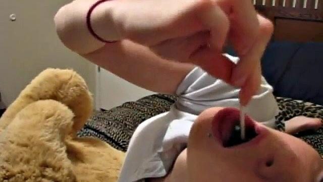 Sexy teen half naked sucking on a lollipop