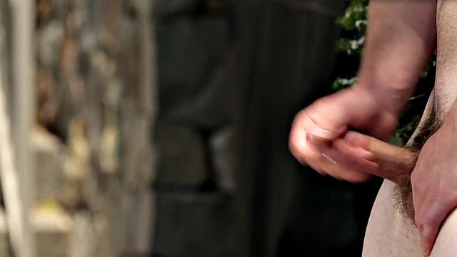 Hunky newbie stroking his dick in outdoor action