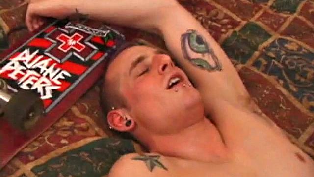Gunner Raines rubs his cock thru his shorts, and then releases a growing boner. A sex toy plugs up Gunner's butthole. The added anal stimulation has the young man pumping a warm load onto his stomach.