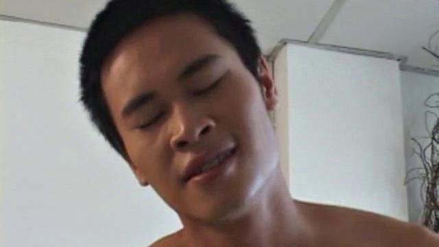 Asian boys Moo and Eak find unlocked storeroom. Eak strips down and sits in chair, while Moo latches onto his big fat cock, an oral exchange follows, until both boys cum