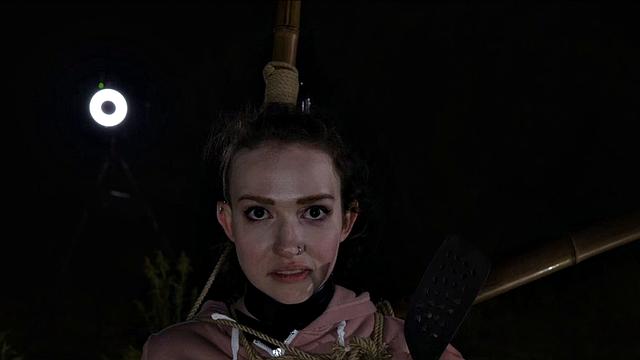 Petite sub put into bondage on a cool night before sucking cock