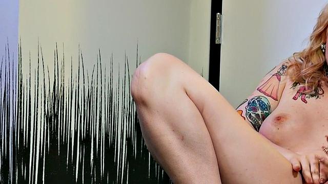 Busty trans beauty tweaks her nipples and tugs cock