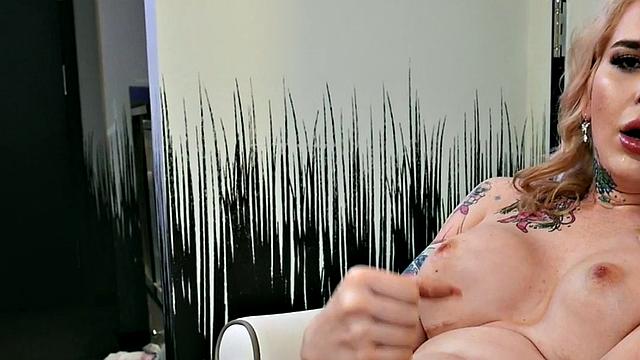 Busty trans beauty tweaks her nipples and tugs cock