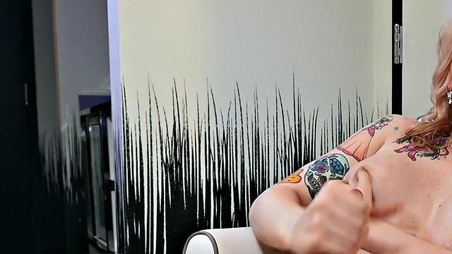 Busty trans beauty tweaks her nipples and tugs cock