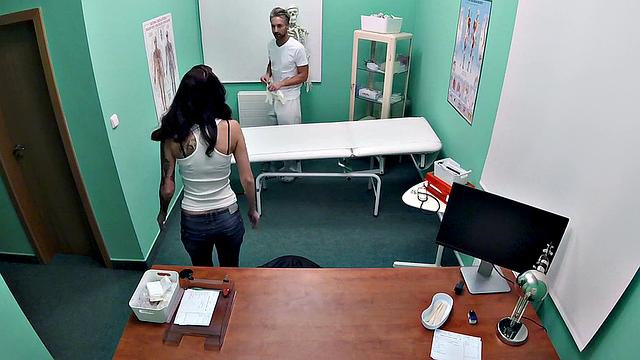 Watch as tattooed doc frees love balls & gives POV handjob in the office