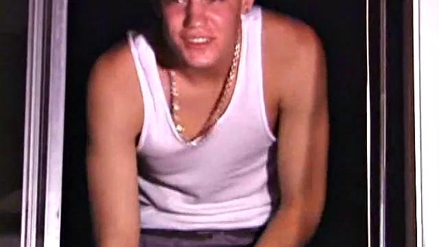 Not content with sitting while he jacks off, Lance teases the neighbors by standing on the roof outside his bedroom window to give everyone a show. Then he finishes by blowing his load onto the floor of his bedroom.