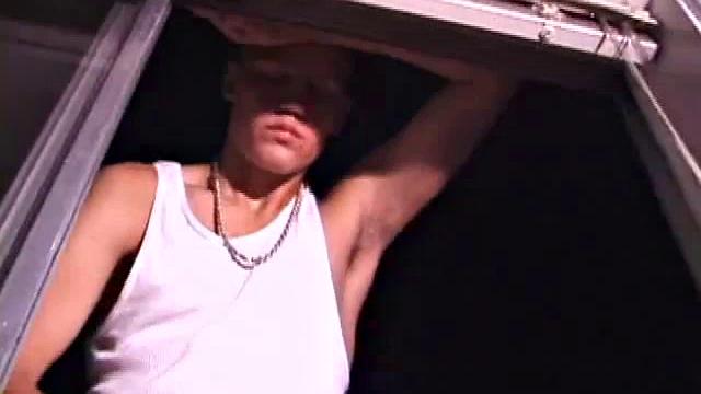 Not content with sitting while he jacks off, Lance teases the neighbors by standing on the roof outside his bedroom window to give everyone a show. Then he finishes by blowing his load onto the floor of his bedroom.