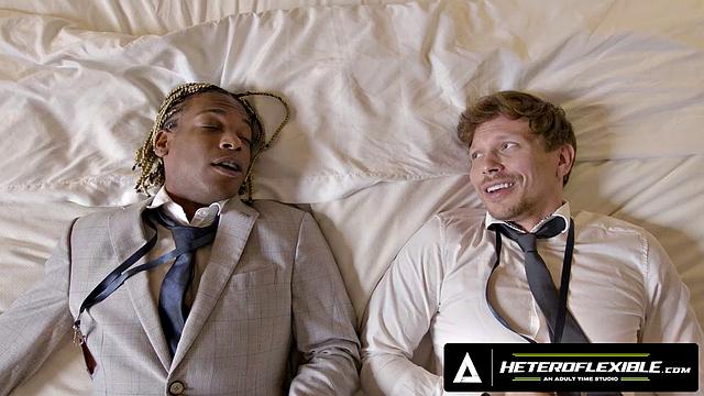 HETEROFLEXIBLE - Colleagues Adrian Hart & Ethan Chase Share Hotel Room During Flight Delay