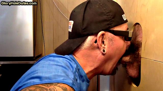 Gloryhole cocksucker blows nice dick while jerking