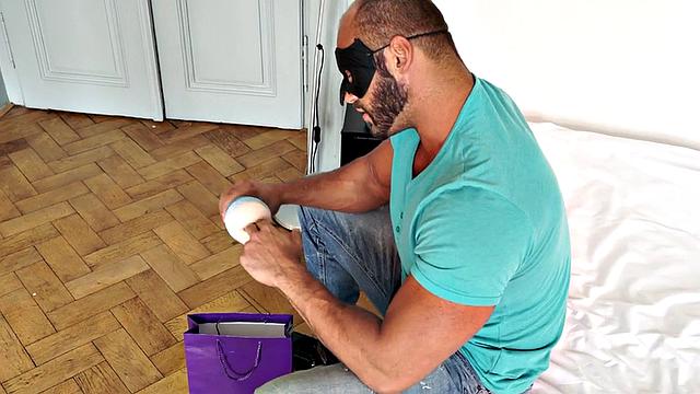 Masked athletic hunk wanks cock with sex toy and cums