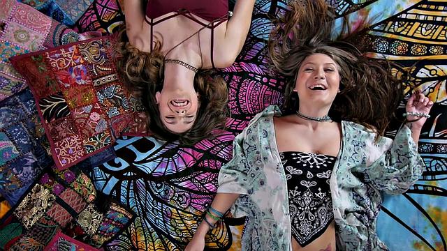 Tattooed chick with brown hair gets down and dirty in a hot concert thong