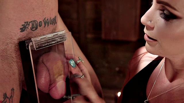 BDSM domina whipping sub and tormenting his genitals