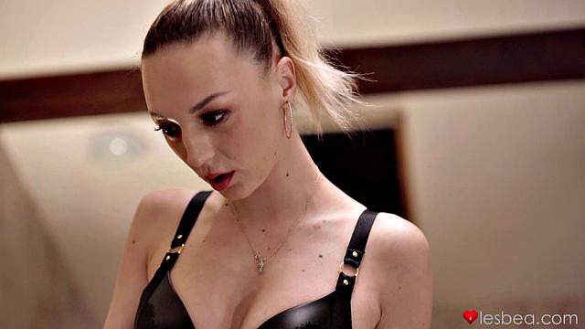 Blonde domme in leather and lingerie