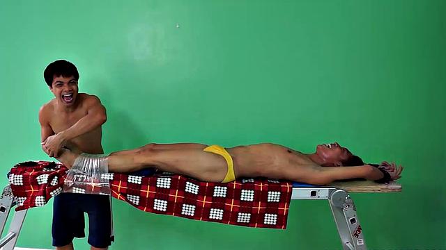 Rave makes his debut appearance on Laughing Asians in this gay Asian tickling fetish scene. This cute Asian boy is strapped down to the tickle rack as resident tickler Vahn Valdez ravages his body with feathers and his wiggling fingers.