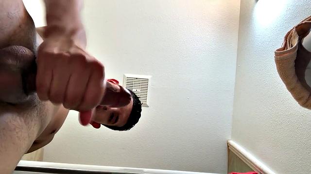 We find Roman Blake in the shower, fingering his ass and playing with his uncut cock. With his big dick rock hard, the Latin boy moves to the bathroom sink and starts stroking.