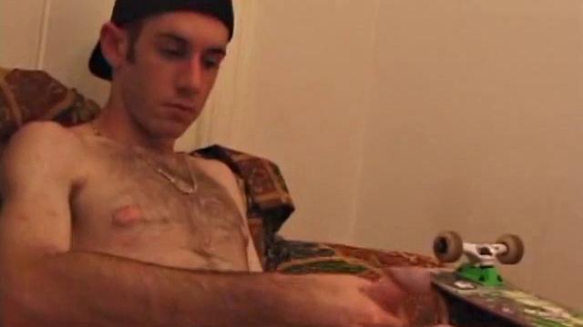 When Tag returns from skateboarding he heads to the bedroom and turns on a video. He begins stripping down and his growing cock flops out. Tag pulls out a couple of sex toys.