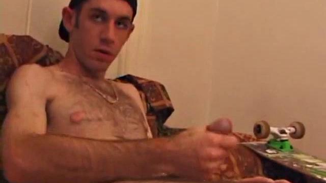 When Tag returns from skateboarding he heads to the bedroom and turns on a video. He begins stripping down and his growing cock flops out. Tag pulls out a couple of sex toys.