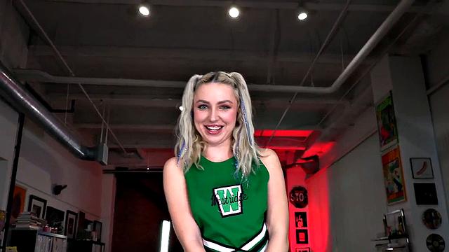 College cheerleader gives hand to her BF after match