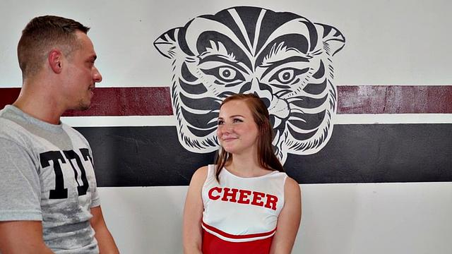 Cheerleader redhead fucked in gym MMF threesome