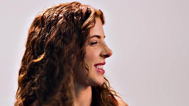 Beauty teasing herself with dildo