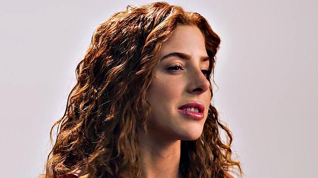 Beauty teasing herself with dildo