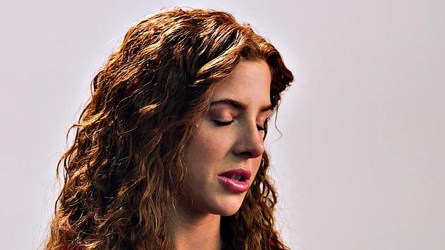 Beauty teasing herself with dildo