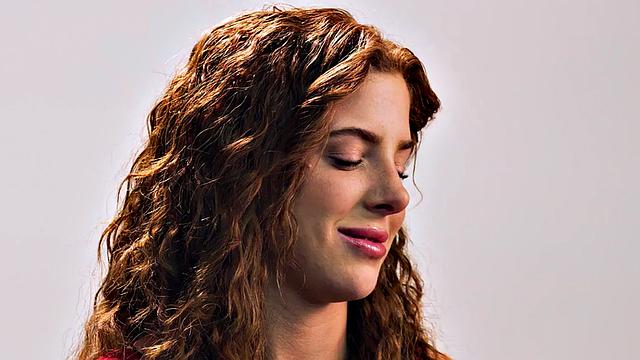 Beauty teasing herself with dildo