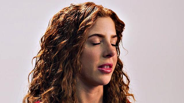 Beauty teasing herself with dildo