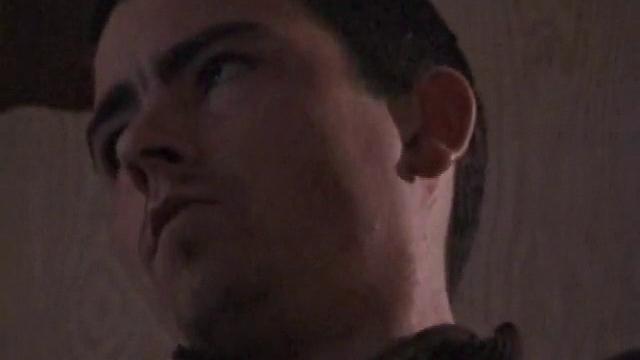 By the time the camera finds him, Dan is already going for his woody. He seems uncomfortable in the chair, so he stands up and moves to the staircase, where we can see his cock getting harder and harder.