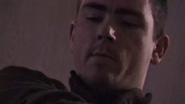 By the time the camera finds him, Dan is already going for his woody. He seems uncomfortable in the chair, so he stands up and moves to the staircase, where we can see his cock getting harder and harder.