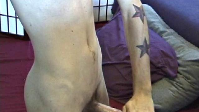 Dan's clothes quickly strip off and he pumps steadily with his left hand, showing the two stars tattooed on his forearm. Lubrication enhances Dan's serious stroke show.