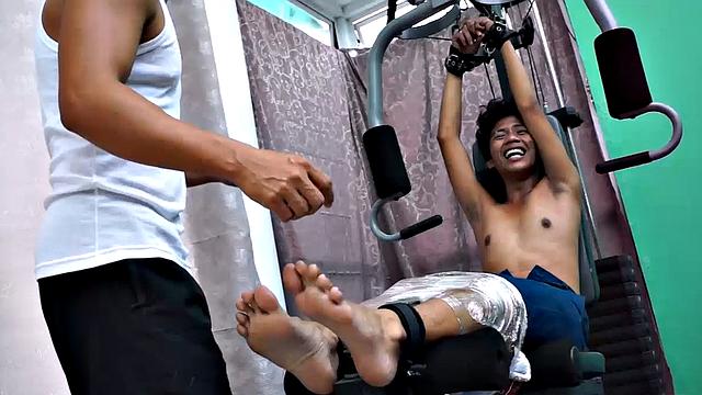 These boys just keep coming for a workout, and they surely get one! This time Asian cutie Idol gets restrained to the equipment for a hearty tickle workout on every muscle of his body.
