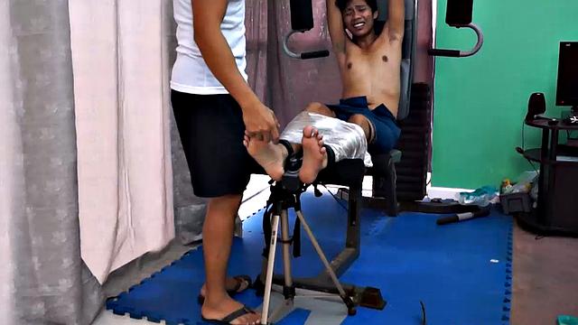 These boys just keep coming for a workout, and they surely get one! This time Asian cutie Idol gets restrained to the equipment for a hearty tickle workout on every muscle of his body.