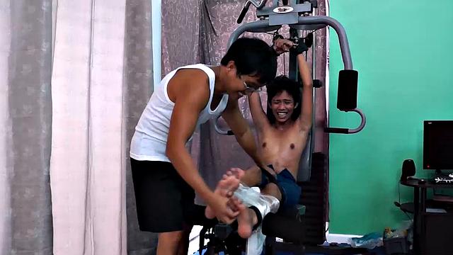 These boys just keep coming for a workout, and they surely get one! This time Asian cutie Idol gets restrained to the equipment for a hearty tickle workout on every muscle of his body.