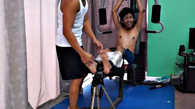 These boys just keep coming for a workout, and they surely get one! This time Asian cutie Idol gets restrained to the equipment for a hearty tickle workout on every muscle of his body.
