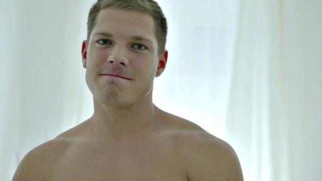 Ripped hunk jerking off solo before cumming over hands